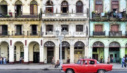 Street scene with vintage car in Havana, Cuba.